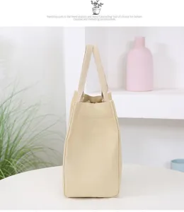 Minimalist beige canvas lunch bag detail, lightweight portable bento tote for daily use.
