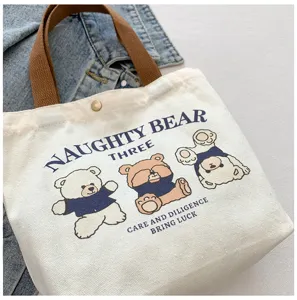 Canvas tote bag with cute bear print and brown handles, daily casual commuter handbag.