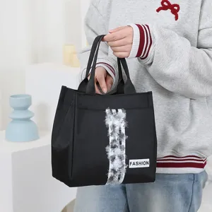 Stylish black tote bag for women, durable commuter handbag and convenient daily lunch bag.