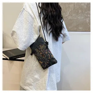 Close-up detail of Chinese style floral cross-body phone bag with delicate retro print.