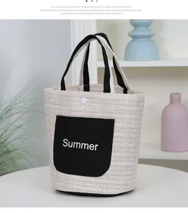 Stylish straw woven tote bag with contrast black pocket, perfect for summer beach and daily use.
