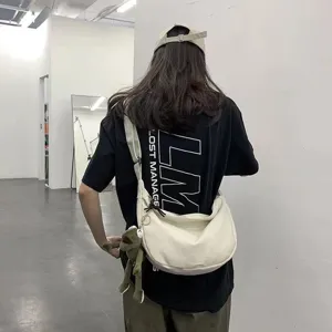 Minimalist canvas crossbody bag with cute plush toy pendant, casual trendy messenger bag for daily use