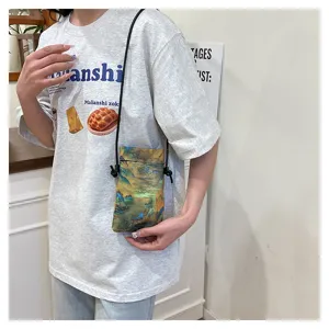 Detailed view of a vintage Chinese style landscape print mini crossbody phone bag.