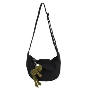 Black canvas crossbody bag with cute frog pendant, casual minimalist shoulder bag.