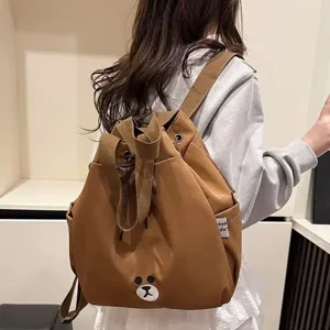 Brown multi-function casual backpack with cute bear patch for daily travel and school use