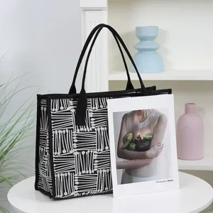 Black and white canvas tote bag large capacity casual shoulder bag main view display.