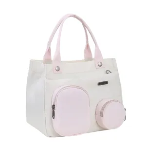 Chic mini canvas handbag and cute shoulder tote bag with multiple front pockets for women daily use.