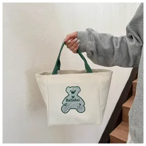 Canvas tote bag with green handles and cute line art bear print casual daily handbag.