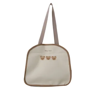 Korean style canvas tote bag with cute bear embroidery and brown trim for daily use.