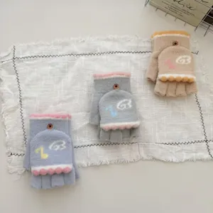 Womens winter convertible half-finger plush knit gloves with cute music notes pattern.
