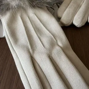 Detail view of women winter warm gloves, soft faux suede with plush fur cuff and triple ribs.