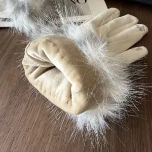 Detailed view of women winter warm touch screen suede gloves with fluffy plush fur cuff.
