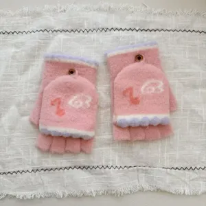 Detailed view of women's plush fingerless convertible winter gloves in pink, cozy warm knit.