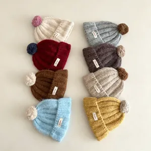 Bonnet tricoté chaud d'hiver pour enfants avec pompon couleur unie bonnet mignon
