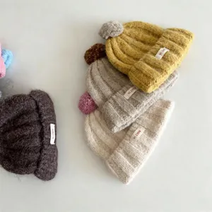 Bonnet tricoté d'hiver pour enfants couleur unie avec pompon, bonnet chaud et élégant à revers.
