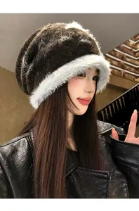 Detailed view of the contrast color star plush knitted slouchy beanie hat for women in autumn and winter.