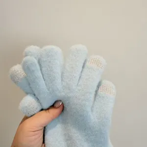 Women winter warm touch screen gloves, fluffy knitted blue gloves with finger tips detail.