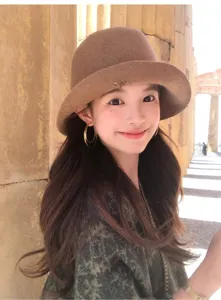 Classic brown wool bucket hat detail, elegant wide brim and soft texture for autumn winter.