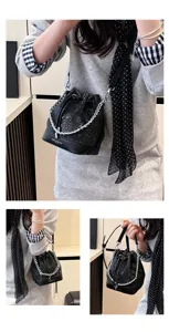 Retro luxe slangeprint trekkoord emmertas elegante dames schoudertas handtas voor vrouwen.