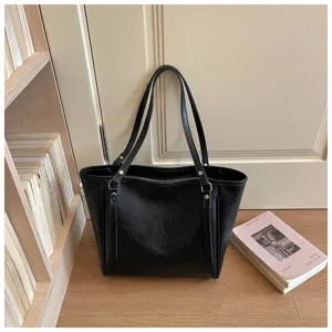Zwarte leren tote bag voor dames, stijlvolle grote schoudertas voor dagelijks gebruik.