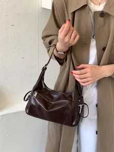 Stylish dark brown leather shoulder hobo bag for women, perfect for daily commuting and chic casual wear.