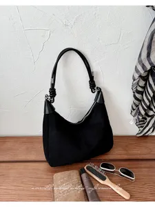 Zwarte suode schoudertas voor dames, stijlvolle vintage hobo tas met geknoopt handvat.