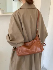 Korean style simple minimalist brown leather shoulder underarm bag for women daily commute.