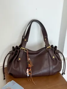 Damen Retro PU Leder Plissierte Tragetasche Große Kapazität Kordelzug Umhängetasche Mode Achsel Pendeln Handtasche Mit Quaste