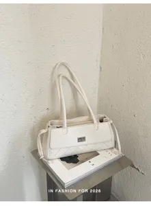 Elegante gewatteerde schoudertas voor dames, klassieke baguette handtas in licht leer.