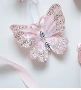 Pink glitter acrylic butterfly pendant Christmas tree hanging decoration for holiday party.