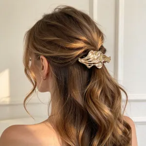 Golden wavy hair claw clip geometric metal retro hair accessory back of head styling details.