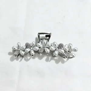 Elegant pearl flower hair claw clip for women, large metallic hair catch accessory styling tool.