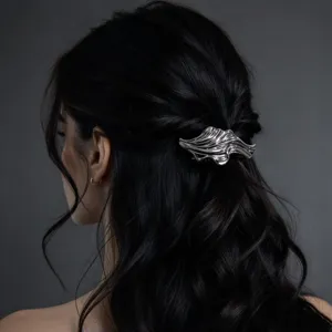 Detailed view of the silver wavy geometric hair clip, elegant metal design for retro styling.