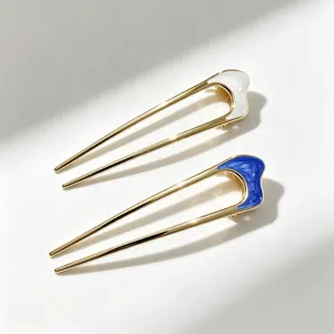 Élégante fourche à cheveux en U dorée avec un design en émail chic pour femmes.