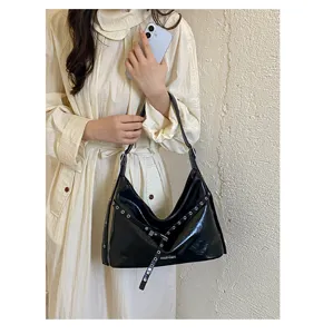 Korean style black PU motorcycle shoulder bag for women, edgy metal grommet design chic handbag.