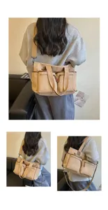 Gedetailleerd overzicht van de casual corduroy shopper met meerdere vakken gedragen door model.