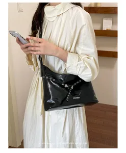 Black PU motorcycle shoulder bag for women, trendy Y2K aesthetic retro crossbody bag.