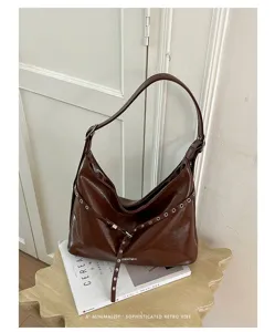 Brown PU leather shoulder hobo bag with metal eyelets and chic retro motorcycle style design.
