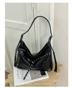 Trendy black PU leather motorcycle shoulder bag with metal grommets and vintage retro style.