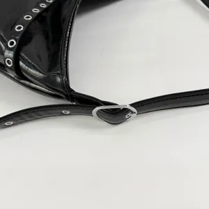 Korean style black PU leather motorcycle shoulder bag detail with metal eyelets and strap.