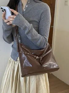 Korean retro glossy PU motorcycle shoulder bag for women, chic brown casual crossbody bag.