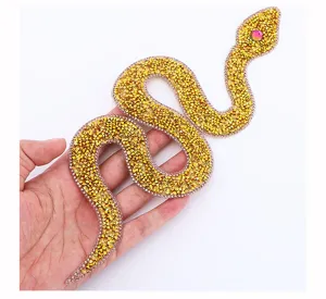 Gold rhinestone snake patch for DIY clothing and bag decoration with sparkling resin stones.