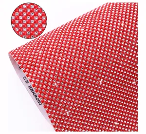 Red resin rhinestone mesh hot fix adhesive sheet for DIY clothing and bag decoration.