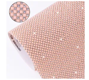 Detailed view of pink resin rhinestone mesh sheet, hot melt adhesive hotfix crystal trim.