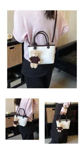 Detailed view of women's color-block shoulder bag with cute bear plush pendant accessory.