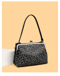 Elegante borsa a mano con stampa leopardata in bianco e nero con manico per donne.