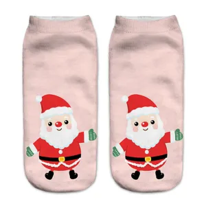 Close-up detail of cute Christmas Santa print on soft pink ankle socks, vibrant colors.