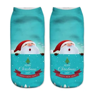 Close-up of Christmas 3D printed short socks featuring cute Santa and holiday text details.