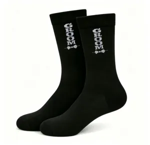Black crew socks with groom text detail for wedding groomsmen and male guests wear.