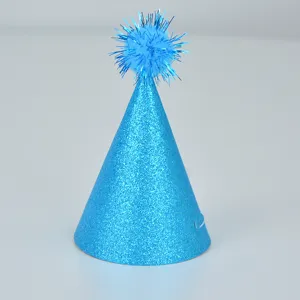 Blue glitter cone party hat detail showing sparkling surface and tinsel pom pom top